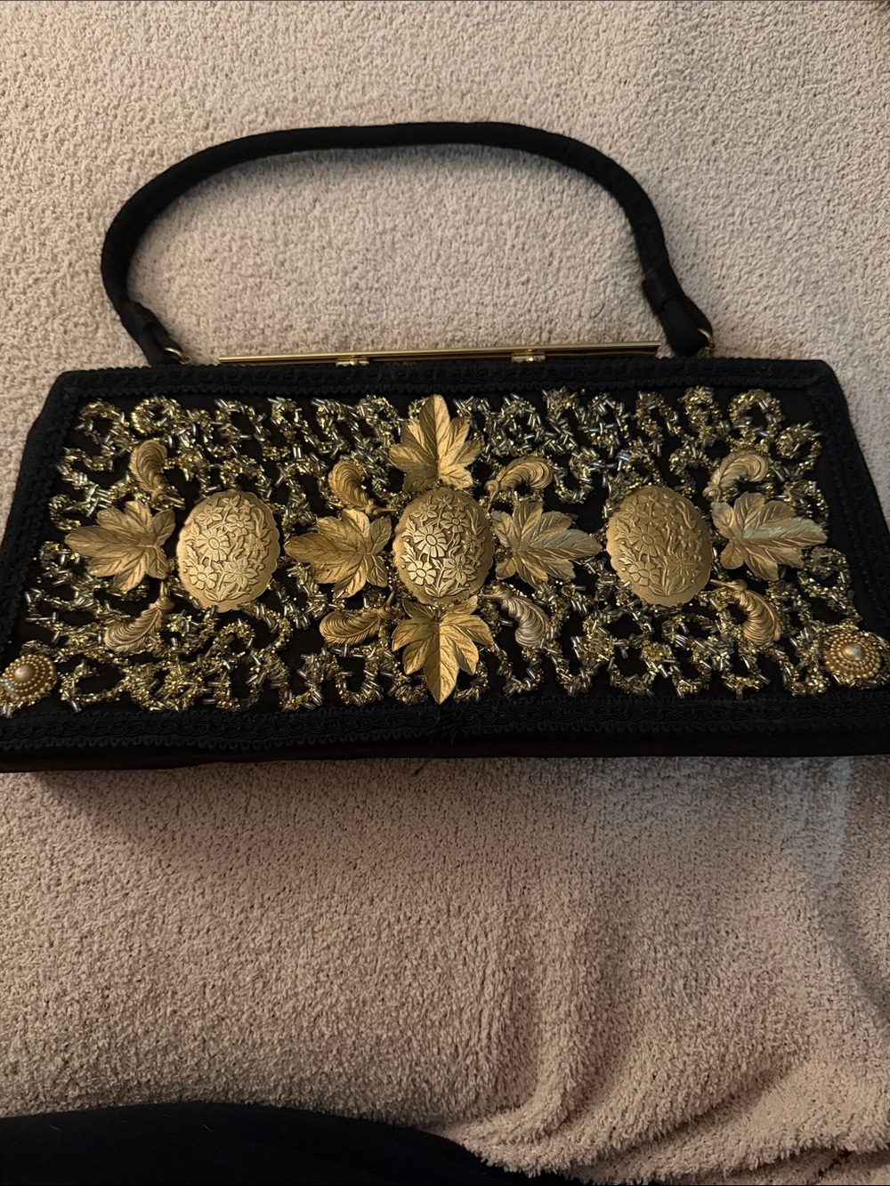 Black Clutch with Ornate Gold Medallion Embellishments
